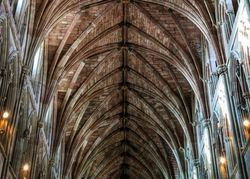 Ornate vaulted ceiling inside Worcester Cathedral with stone arches and gothic detailing