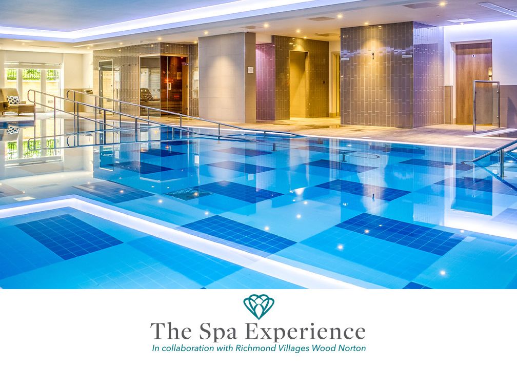 Modern indoor spa pool with lounge chairs and ambient lighting