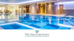 Indoor luxury spa pool area with lounge chairs and modern design elements