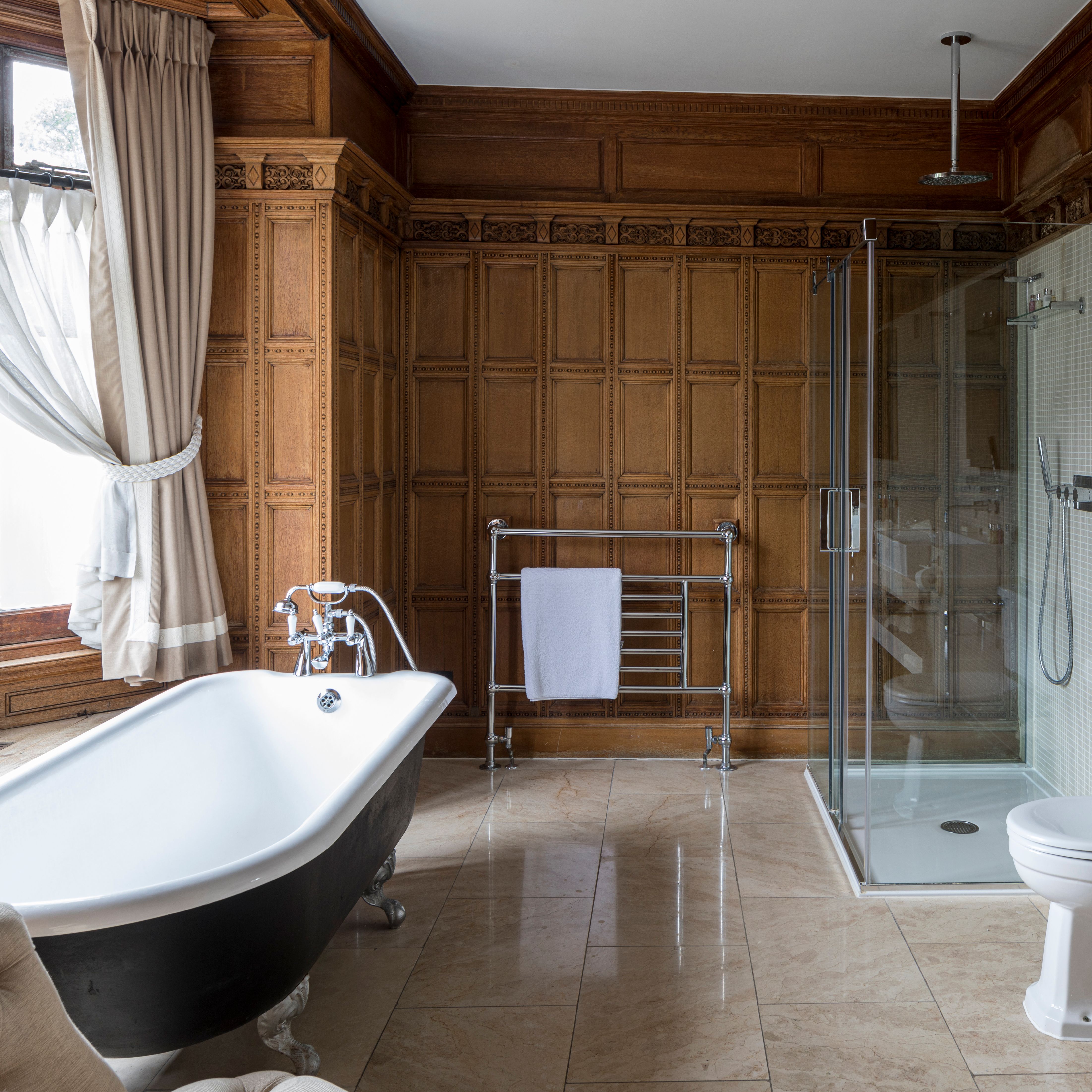 luxury bathroom with roll top bath and walk in shower