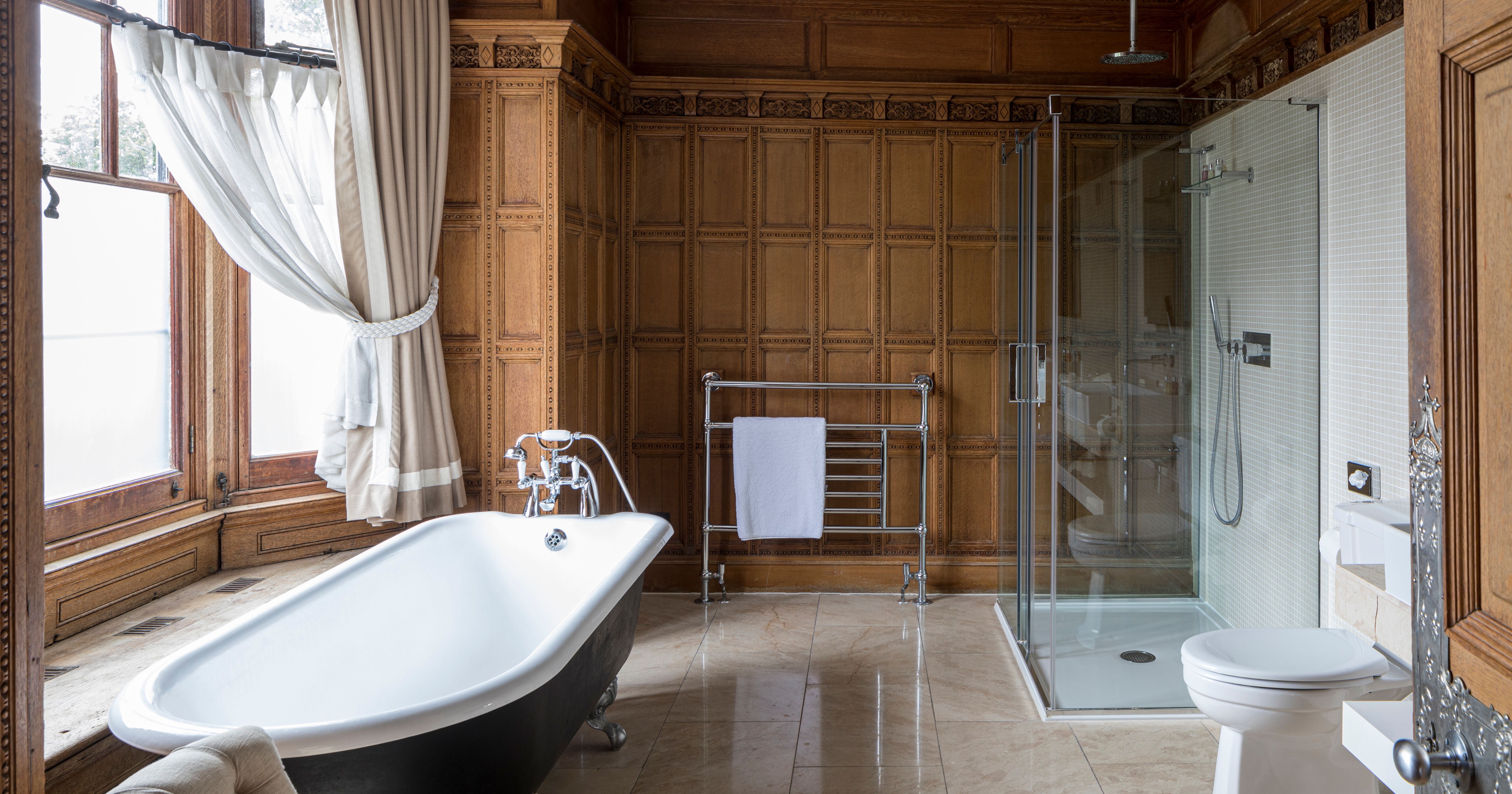 luxury bathroom with roll top bath and walk in shower
