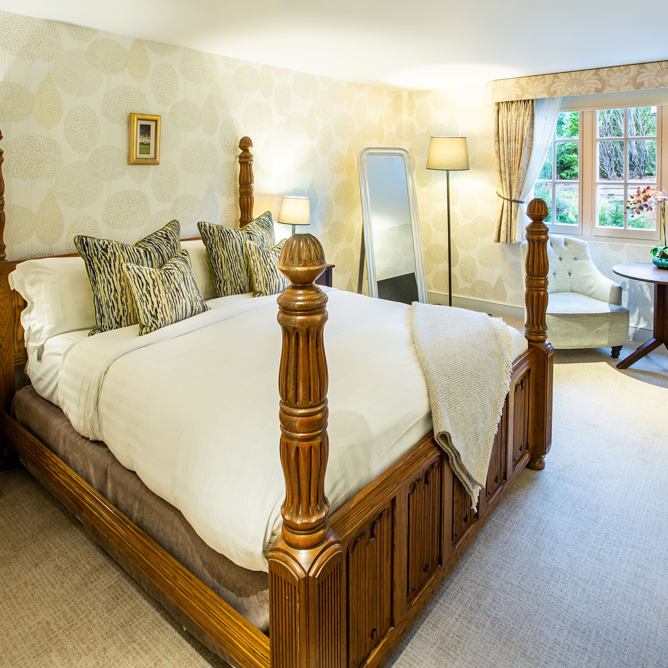 large bedroom with four poster bed