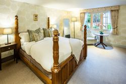 large bedroom with four poster bed