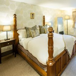 large bedroom with four poster bed