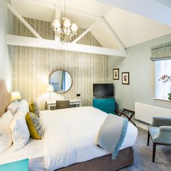 double room with beams in the roof