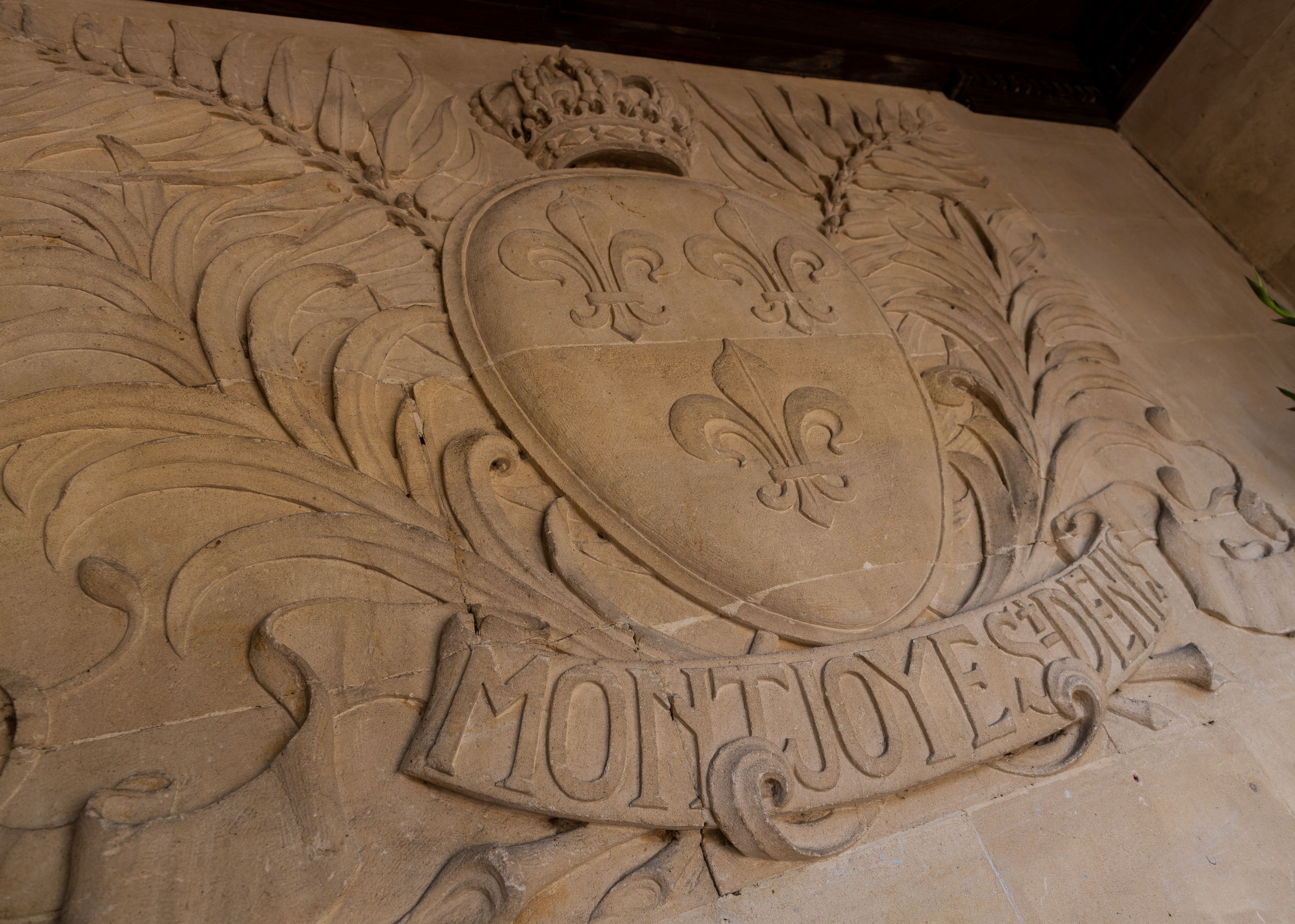 Carving into stone of crest